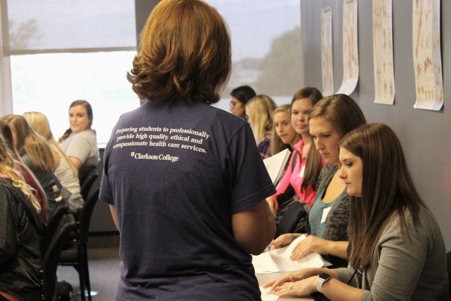 Students listening in a classroom at a New Student Orientation event